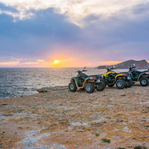 Quad Bikes On A Hill With A Nice Sunset